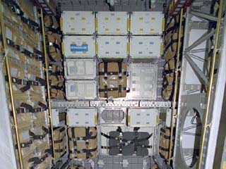 Interior view of stowage in the STS-86 Atlantis Spacehab module prior to transfer of equipment to the Mir space station. 